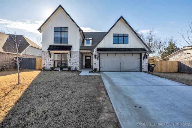 modern farmhouse featuring a front yard and a garage