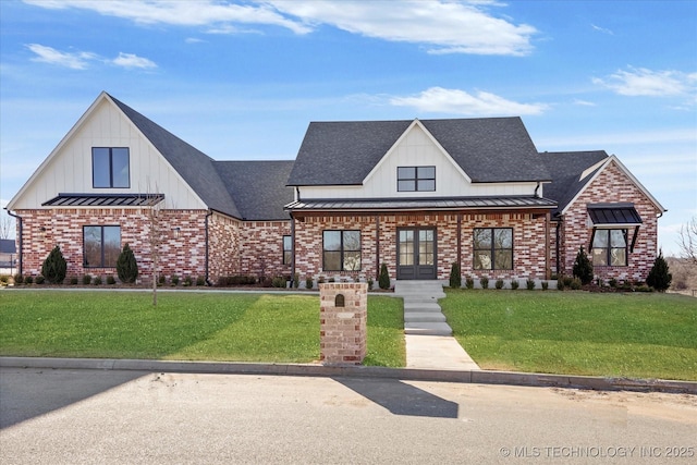 view of front of property with french doors and a front lawn