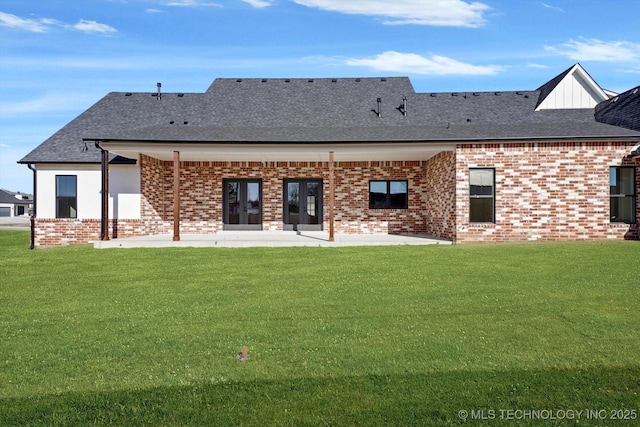 rear view of property featuring a yard and a patio