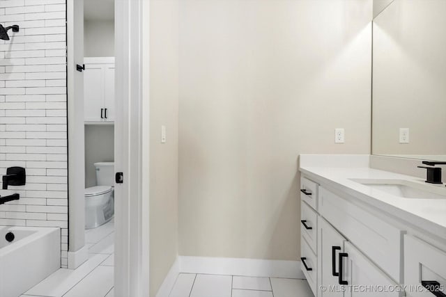 full bathroom with tiled shower / bath, tile patterned flooring, vanity, and toilet