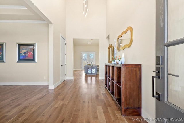 corridor featuring french doors and hardwood / wood-style floors