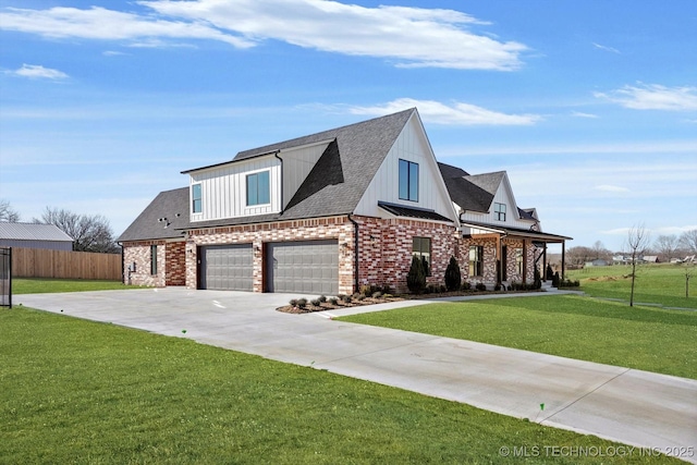 view of front of house featuring a front yard and a garage