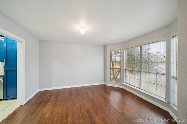 empty room featuring wood-type flooring