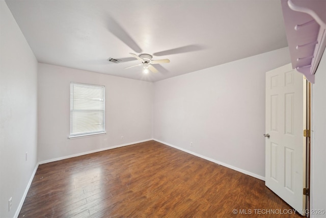 1504 N 26th St, Broken Arrow, OK 74014 - spare room featuring ceiling fan and dark wood-style floors