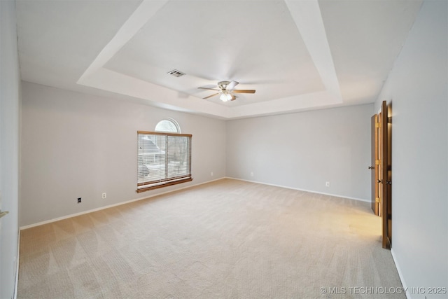 1504 N 26th St, Broken Arrow, OK 74014 - unfurnished room with a raised ceiling, a ceiling fan, and light carpet