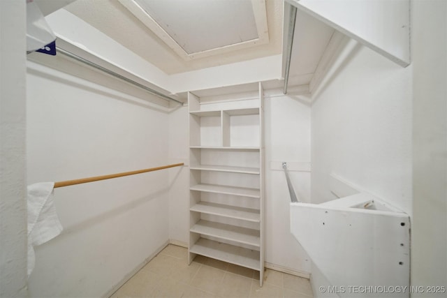 1504 N 26th St, Broken Arrow, OK 74014 - walk in closet with light tile patterned flooring