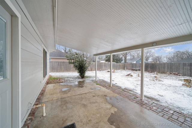 view of snow covered patio