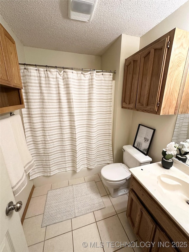 full bathroom featuring tile patterned floors, toilet, a textured ceiling, vanity, and shower / bathtub combination with curtain