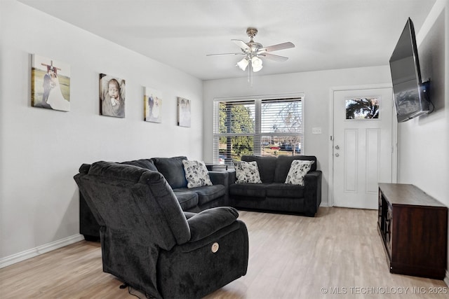 living room with ceiling fan and light hardwood / wood-style floors