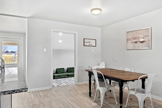 dining area with light wood-type flooring