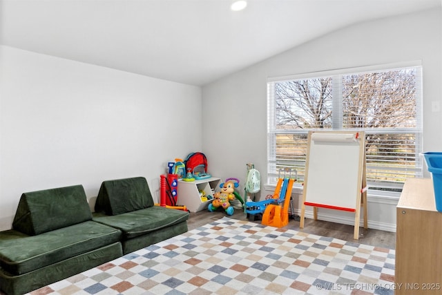 rec room featuring lofted ceiling and light wood-type flooring