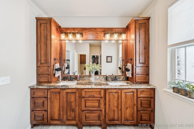 bathroom with double vanity and a sink