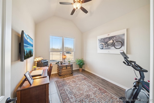 home office featuring dark hardwood / wood-style flooring, ceiling fan, and lofted ceiling