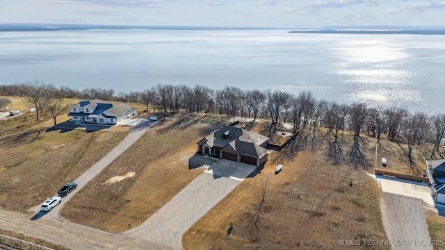 birds eye view of property with a water view and a rural view