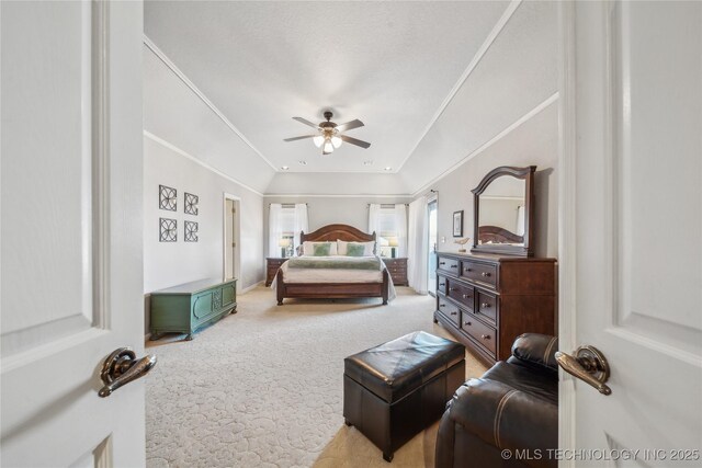 bedroom featuring a ceiling fan, lofted ceiling, carpet, and ornamental molding