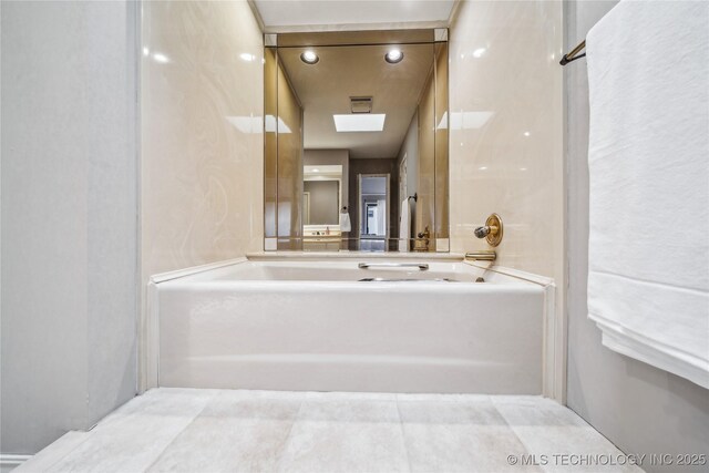 full bathroom featuring a tub and visible vents