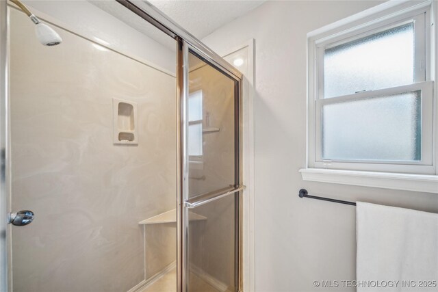 bathroom featuring a stall shower