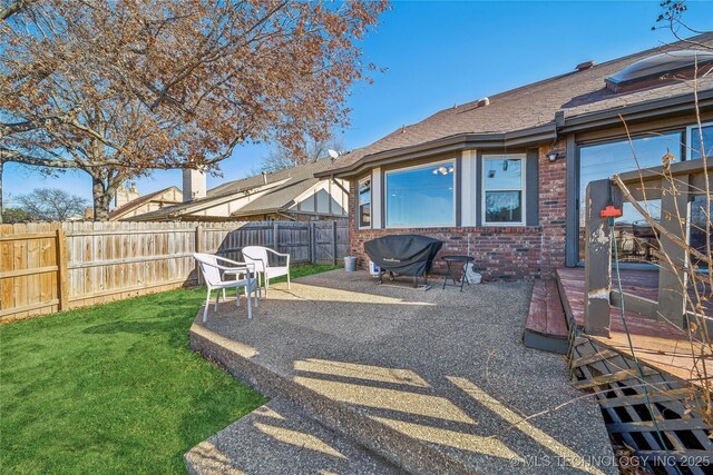 view of yard with a patio and fence