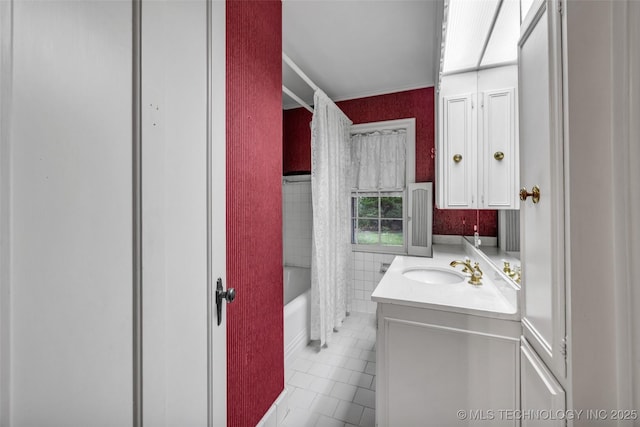 bathroom featuring tile patterned floors, vanity, and shower / bathtub combination with curtain