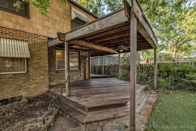 wooden deck featuring ceiling fan