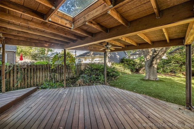 wooden deck with ceiling fan and a lawn