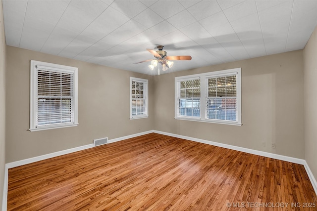 spare room with ceiling fan and hardwood / wood-style floors