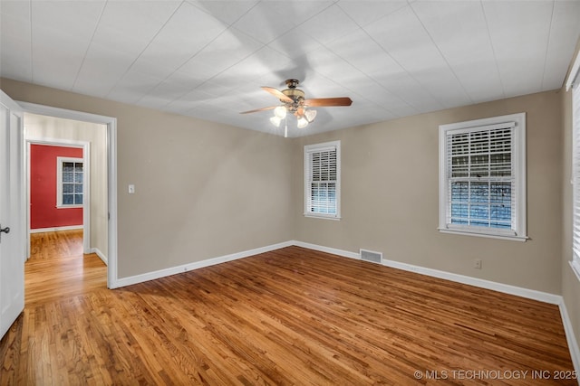 spare room featuring ceiling fan and light wood-type flooring