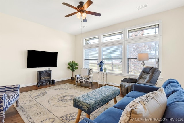 living room with hardwood / wood-style floors and ceiling fan