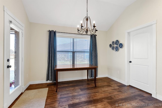 unfurnished dining area featuring lofted ceiling, dark wood-type flooring, and a notable chandelier