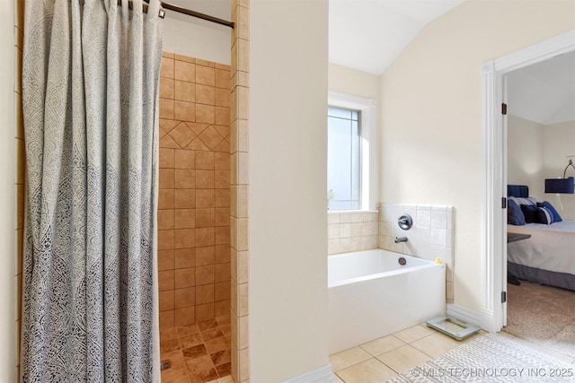 bathroom with vaulted ceiling, shower with separate bathtub, and tile patterned flooring