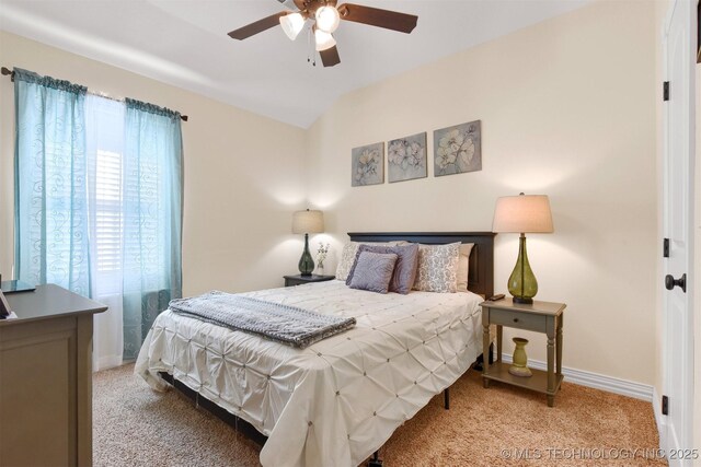 bedroom featuring lofted ceiling, light carpet, and ceiling fan