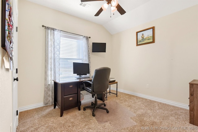 carpeted home office featuring lofted ceiling and ceiling fan