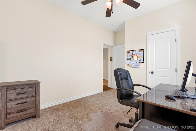 carpeted home office with ceiling fan