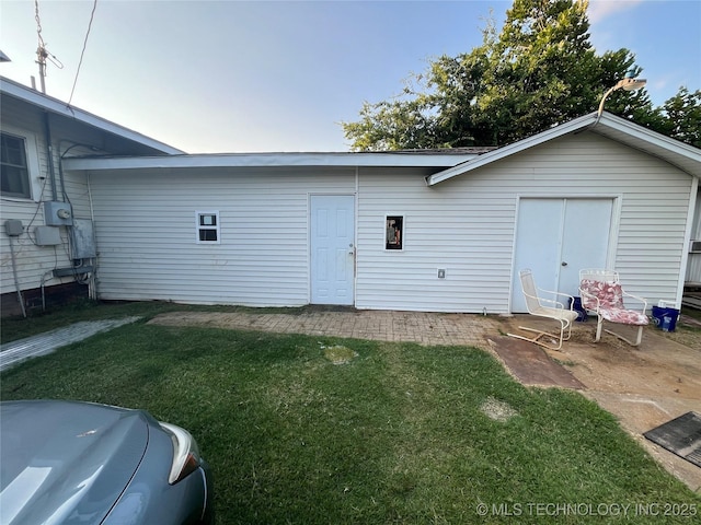 back of house with a yard