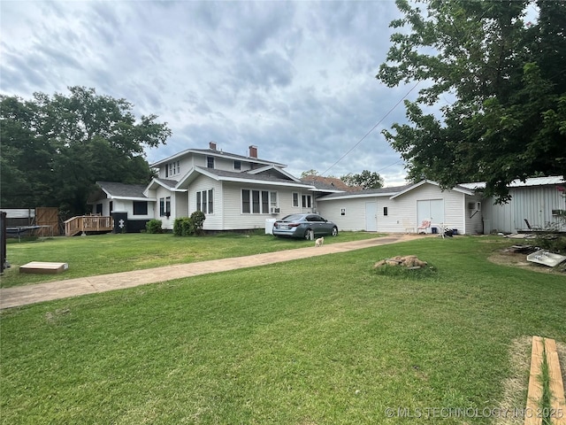 view of front of house featuring a front lawn and a chimney