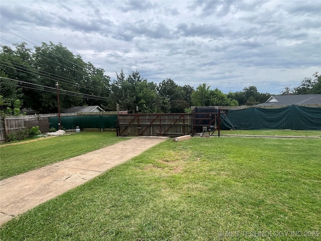 view of yard with a gate and fence