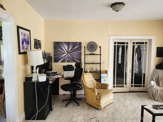 home office with marble finish floor and french doors