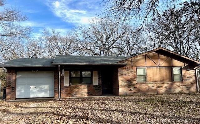 ranch-style home with a garage and brick siding