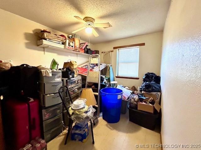 storage area with a ceiling fan