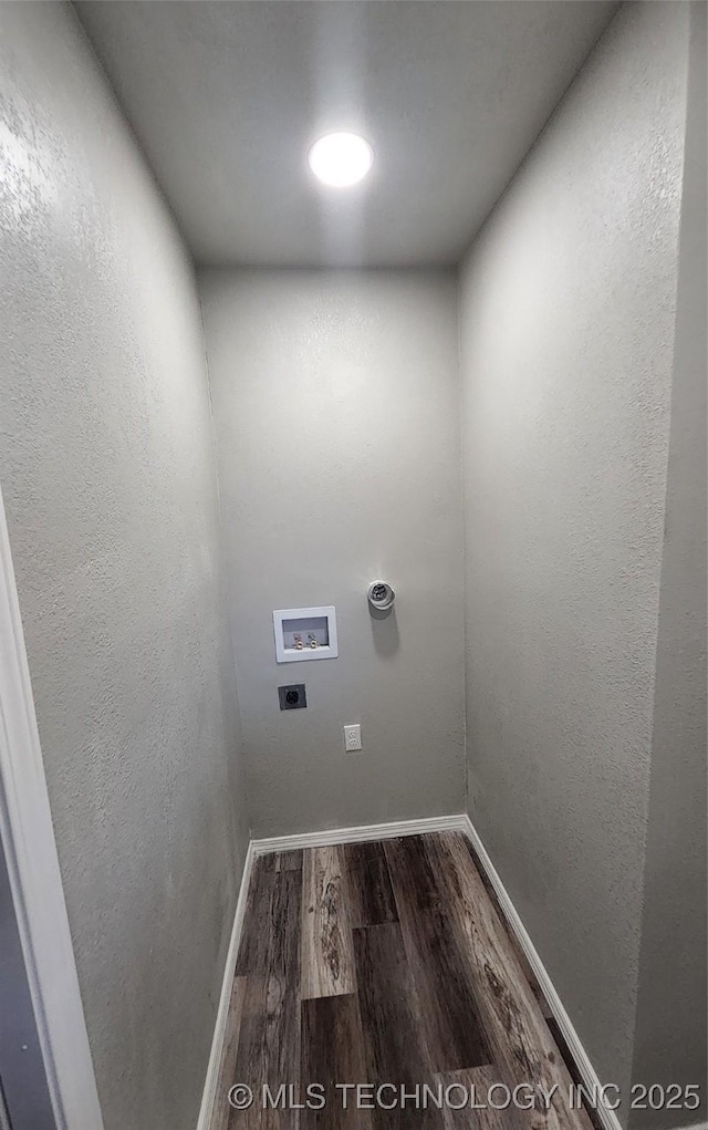 washroom featuring dark wood-type flooring and washer hookup