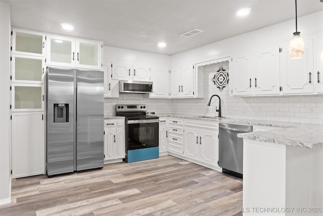 kitchen with visible vents, appliances with stainless steel finishes, white cabinets, and a sink