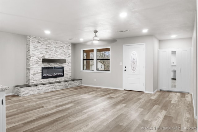 unfurnished living room with recessed lighting, visible vents, light wood-style flooring, and baseboards