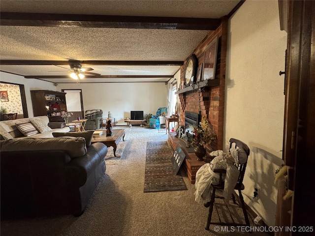 carpeted living room featuring beamed ceiling, ceiling fan, a fireplace, and a textured ceiling