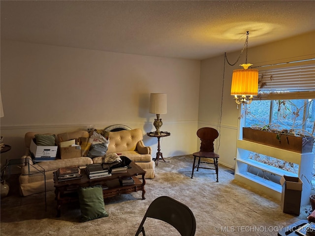 carpeted living room featuring a textured ceiling