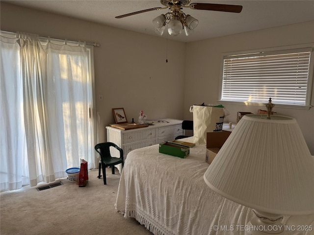 carpeted bedroom with ceiling fan