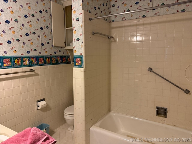 bathroom featuring shower / bathing tub combination and toilet