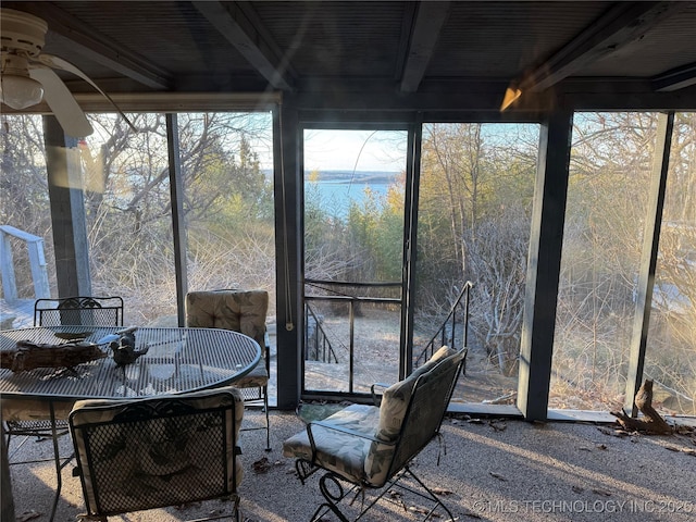 sunroom with beam ceiling