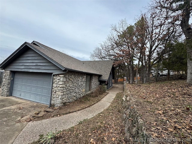 view of side of property with a garage