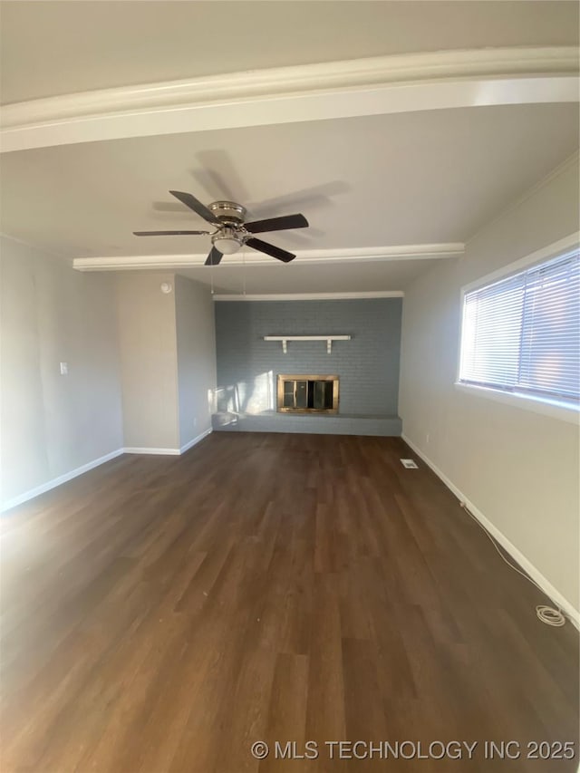 unfurnished living room featuring dark hardwood / wood-style flooring, ceiling fan, and a fireplace