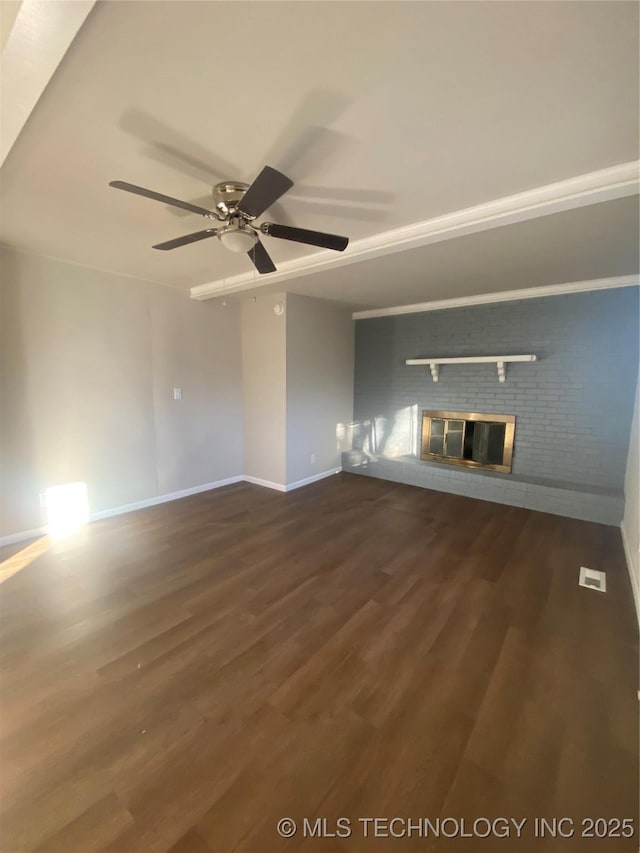 unfurnished living room with a fireplace, dark hardwood / wood-style flooring, and ceiling fan